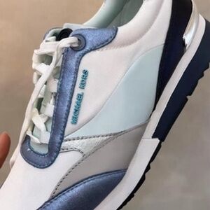 Michael Kors White and Blue Sneakers. Left shoe is 6.5 us & right is 6 us